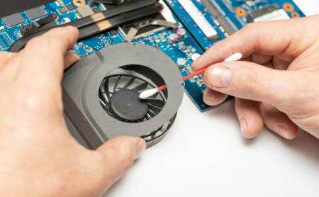 clean a laptop fan with the use of cotton-bud